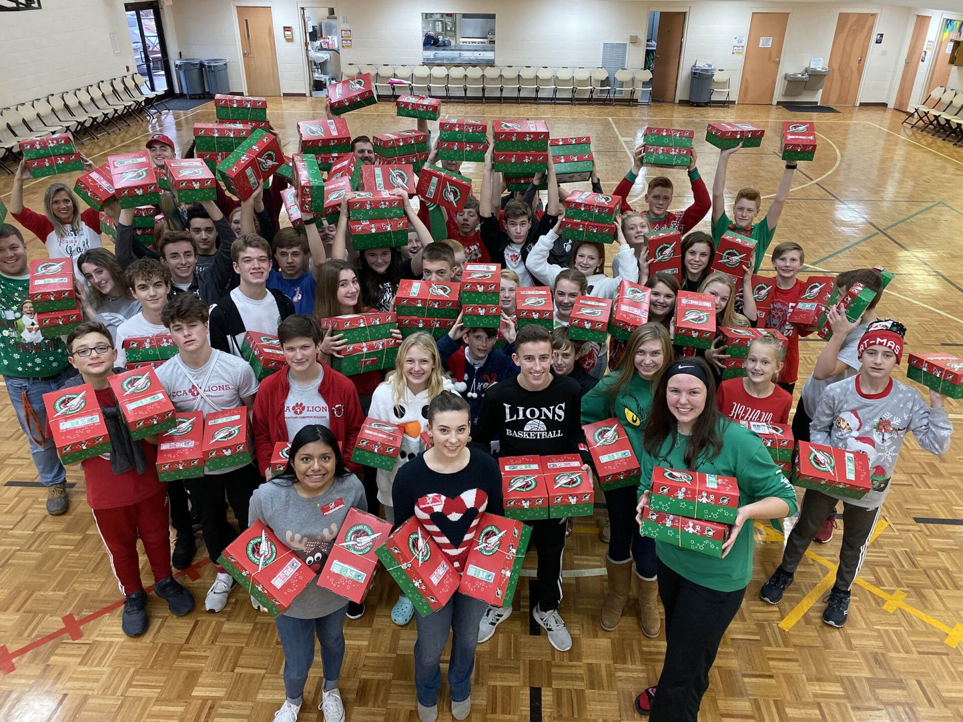 Students from Cornerstone Christian Academy (CCA) participate in the school’s packing party by assembling shoeboxes for Operation Christmas Child.