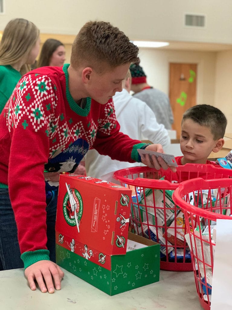 Students from Cornerstone Christian Academy (CCA) participate in the school’s packing party by assembling shoeboxes for Operation Christmas Child.
